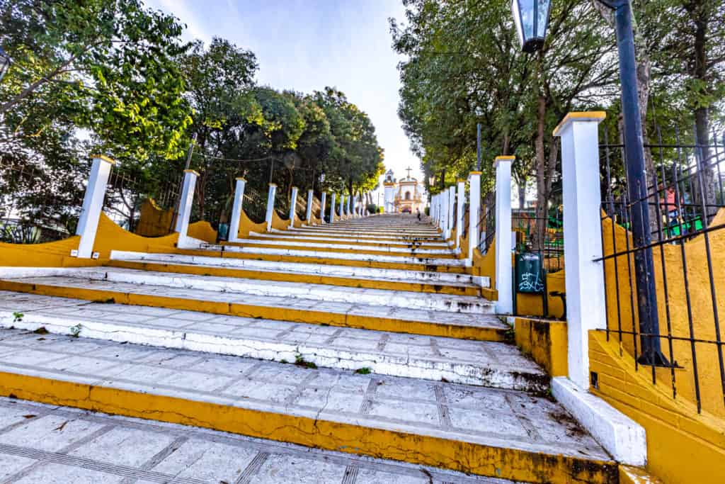 stairs leading up to a churc