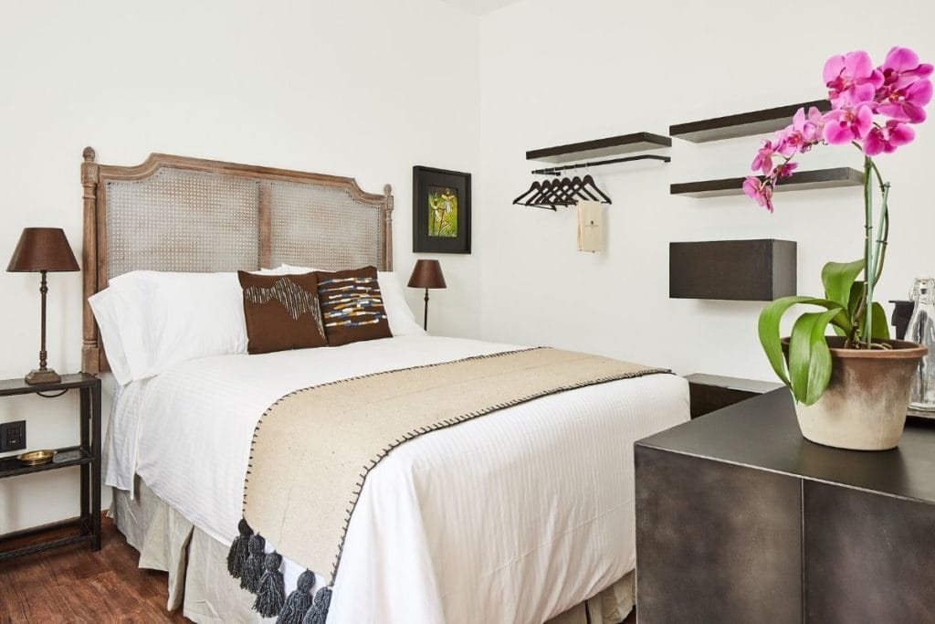 hotel room with double bed and shelves