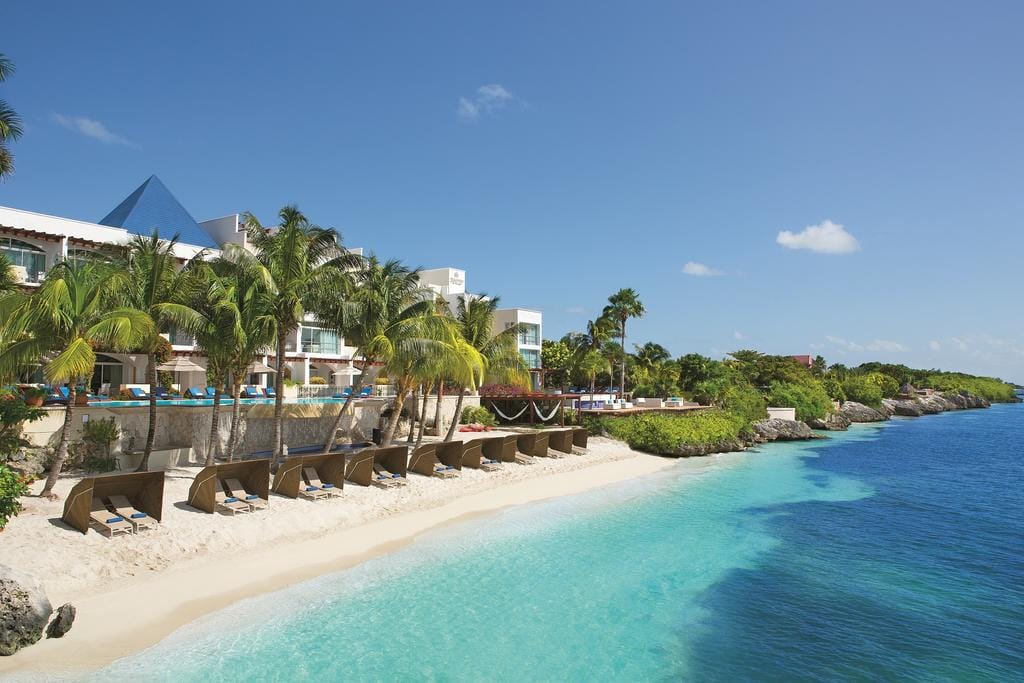 hotel beach with sun beds and sun shades