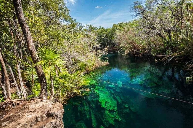 Cenote Escondido near Tulum blue sky