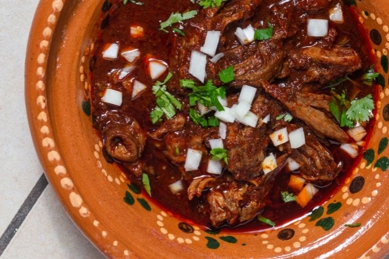 Stewed birria on a traditional plate - Mexican food