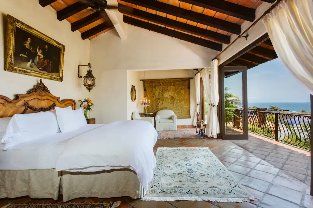 Suite at Hacienda San Angel with a king bed and a large balcony.