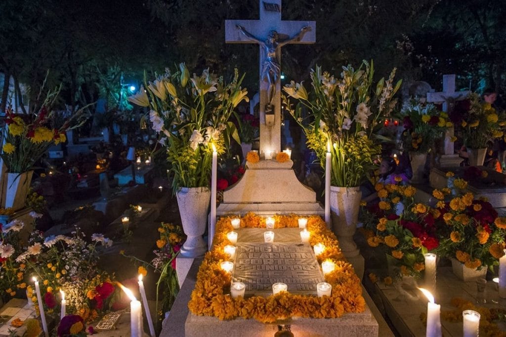 Oaxaca cemetery - grave surrounded by candles 