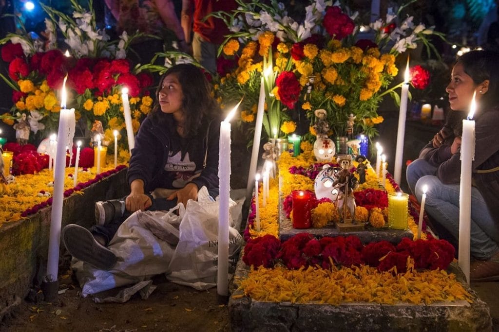 Candles around a grave for the day of the dead in Oaxaca