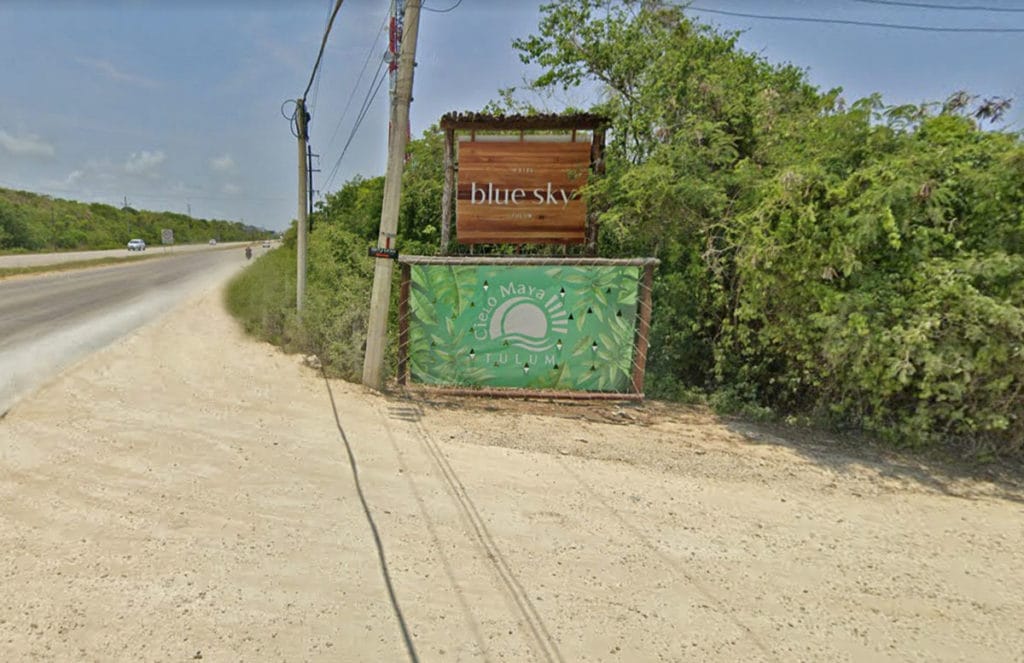 dirt road with hotel signs 