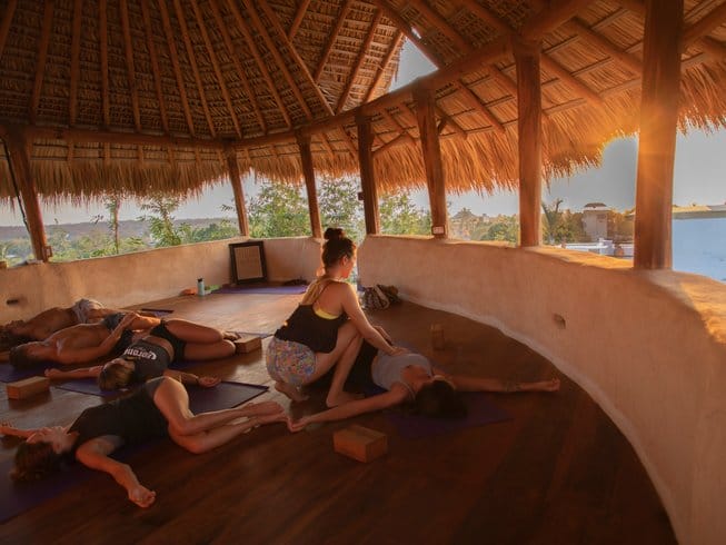 people during a yoga class at sunset