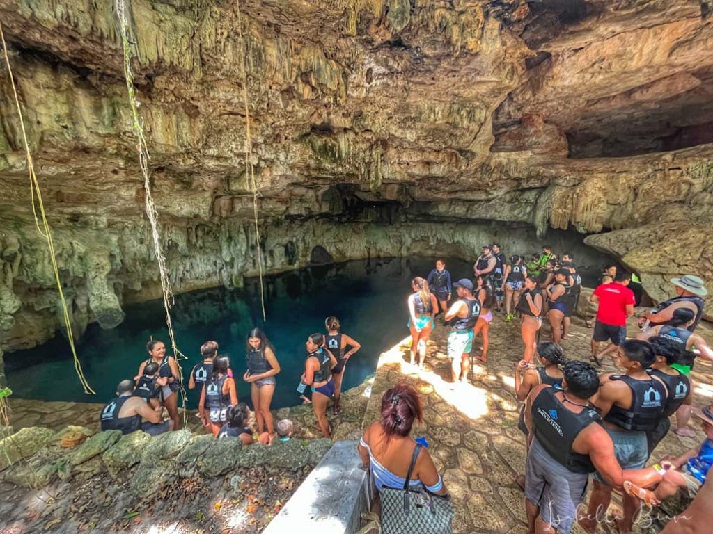 tourists gather up in Cenote Hacienda Mucuyche in Yucatan