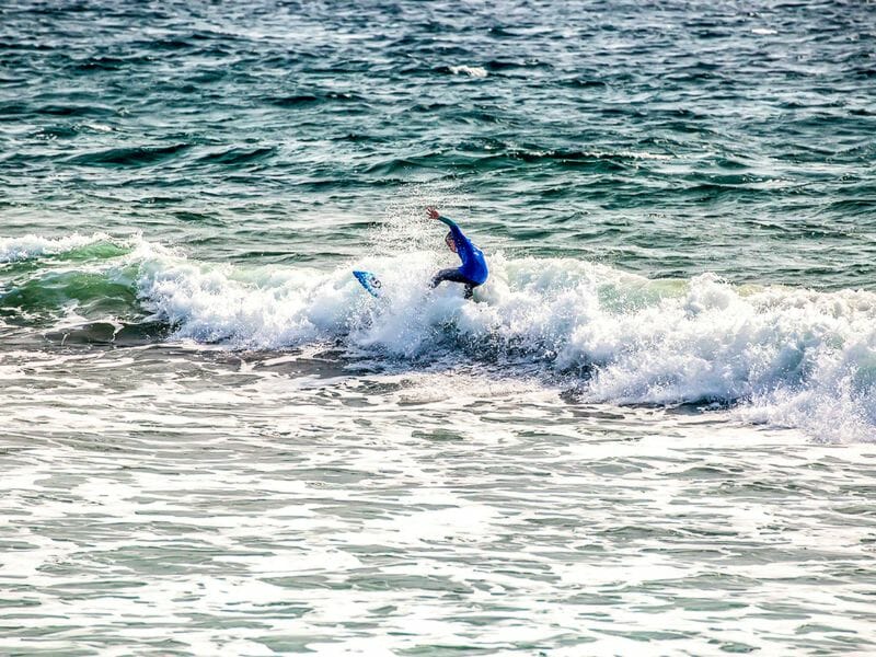 Boy surfing in Todos Santos