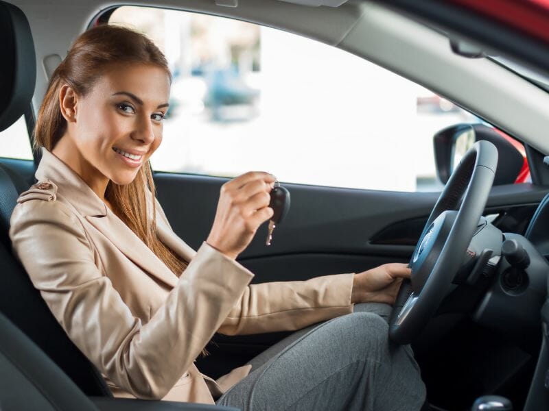 a woman renting a car in mexico