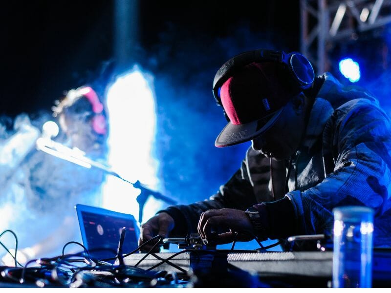 DJ makes the crowd go wild - one of the best things beach clubs in Cabo have to offer.