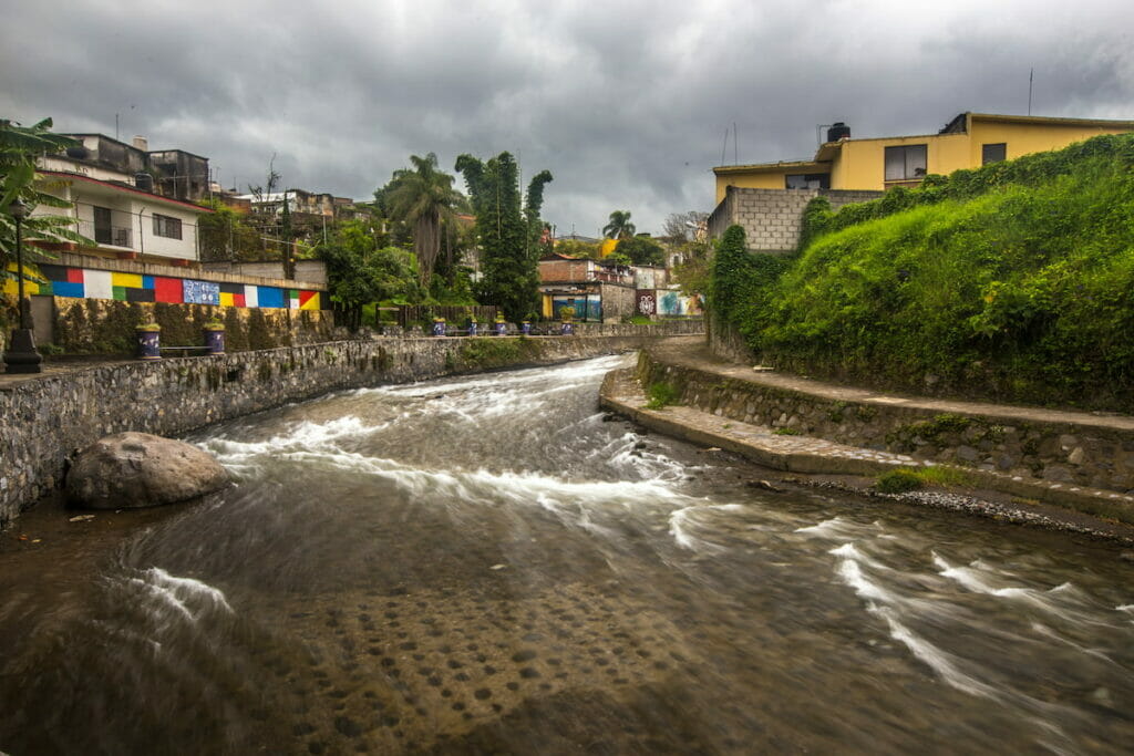 View of a strong current river under a cloudy day in Orizaba Veracruz.