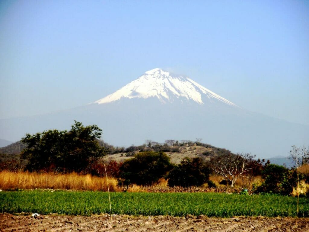 View of the Popocatepetl Volcano and nearby field.