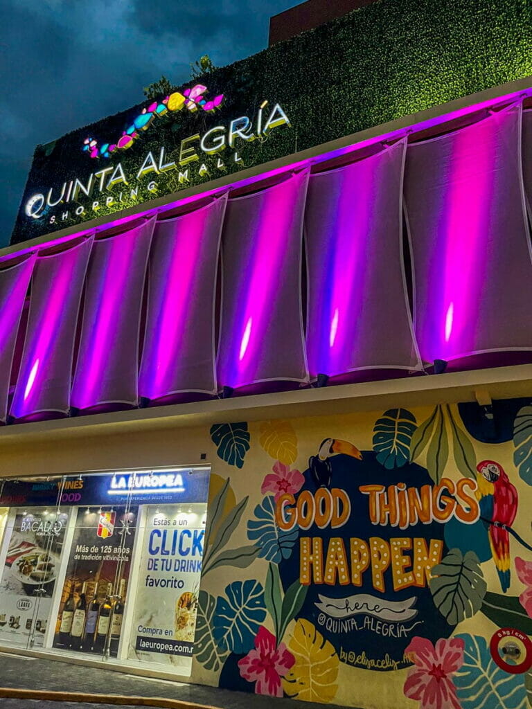 View of the signage of Quinta Alegria at night.