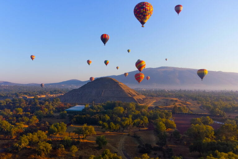 View of the Teotihuacan Pyramid below the hot air balloons in the sky - Teotihuacan hot air balloon tours.