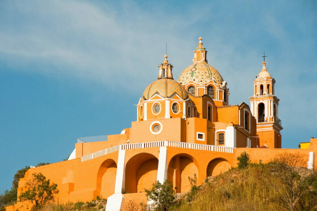 View of the Santuario de Los Remedios under a blue sky.