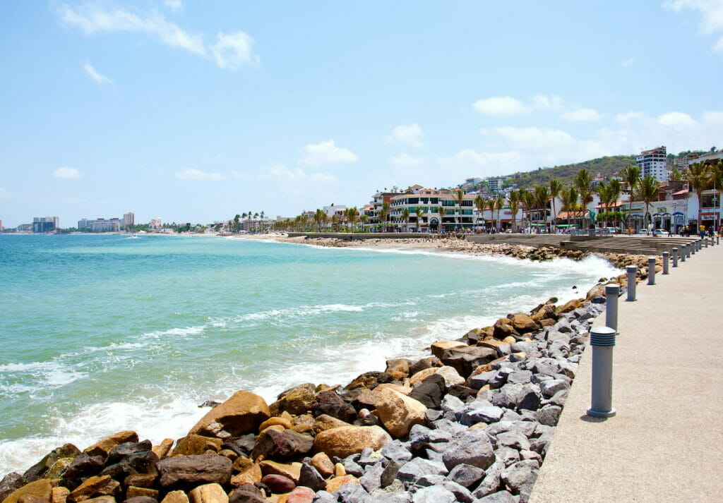 Oceanfront of Puerto Vallarta under a clear sky.