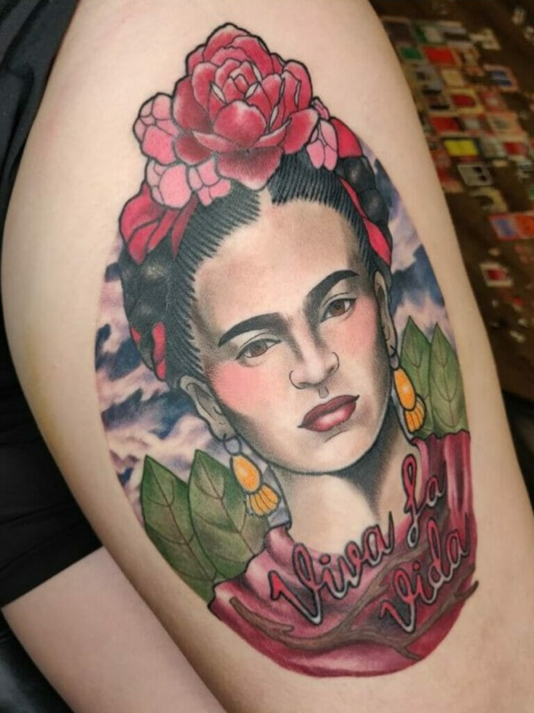 A colored Frida Kahlo Mexican tattoo with flowers and leaves