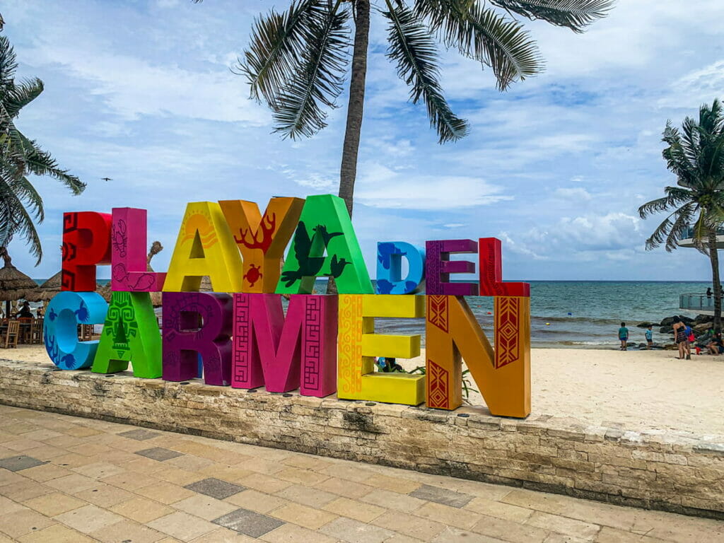 The colorful signage of Playa del Carmen near the beach.