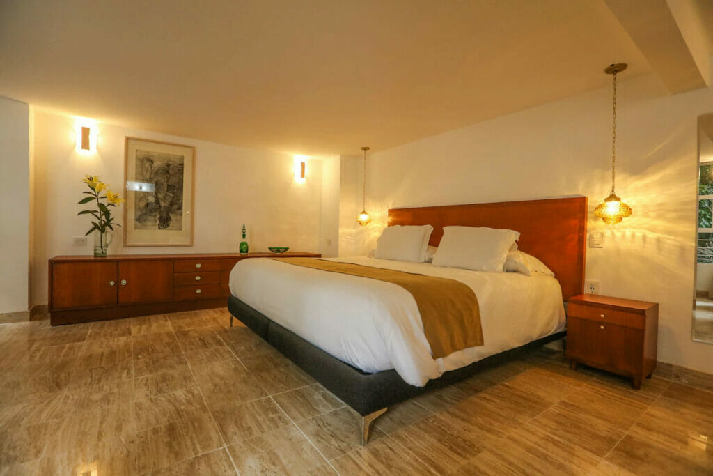 A luxury hotel in Mexico City with a bed and multiple lights.