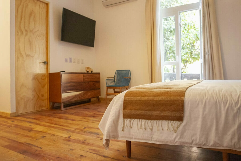 A minimalist room with woooden furnitures.