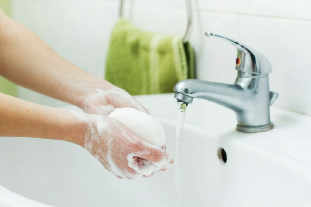 A person washing her hands with soap - how not to get sick in Mexico?  Always wash your hands!