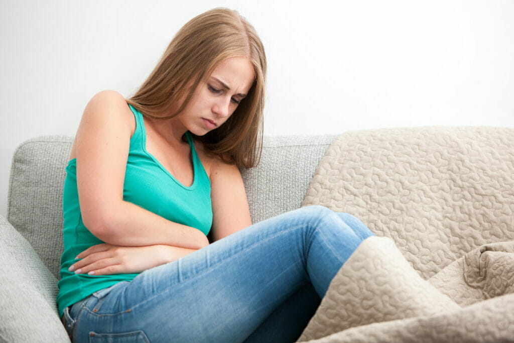 A woman in pain -here's some tips on how not to get sick in Mexico.