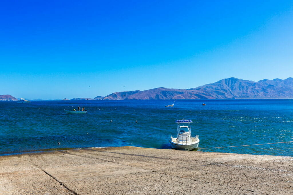 A boat at the dock in the beach in Bahia de los Angeles.