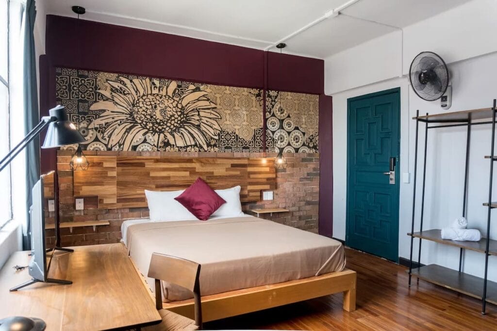 Selina Mexico City room with cozy bed and modern furnitures.