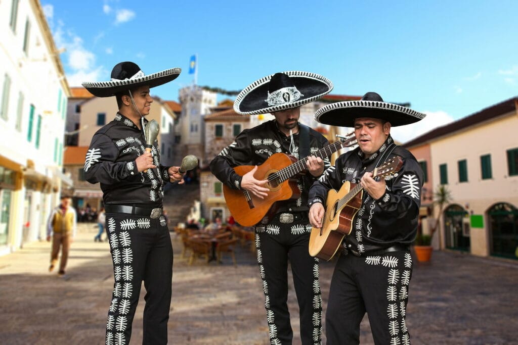 Mexican musicians, also called Mariachis, performing in the middle of the street- one of the popular Mexican holidays and traditions.
