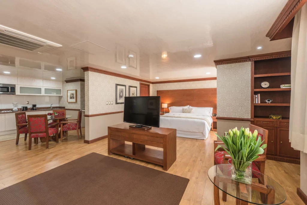 Spacious room at Suites Perisur Apartments.