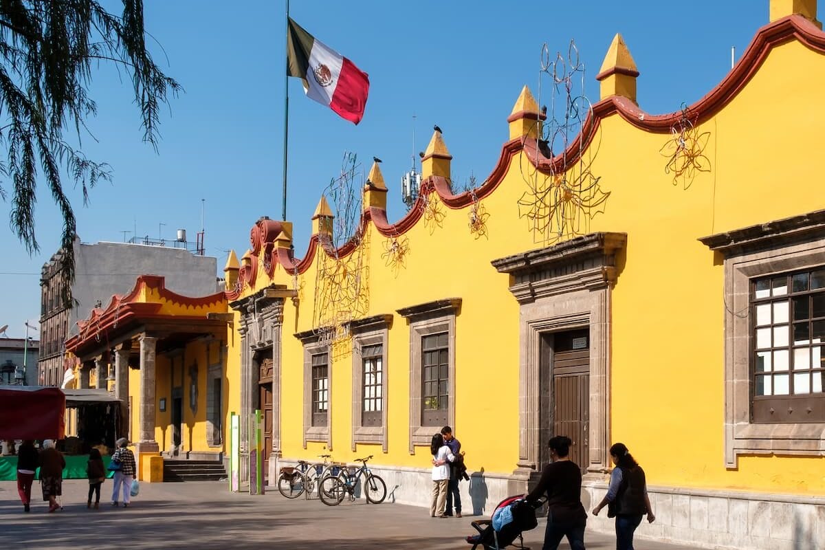 Town Hall Plaza in Coyoacan with Mexican flag on the flag pole.