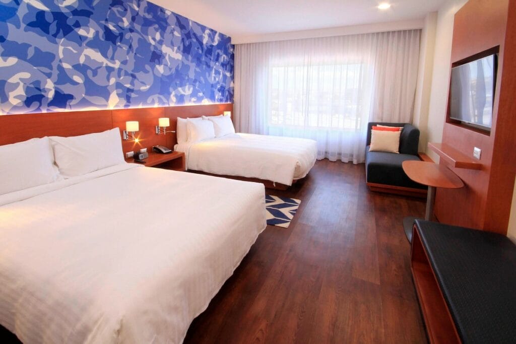 Marriott Hotels in Puebla with two cozy beds in a room.
