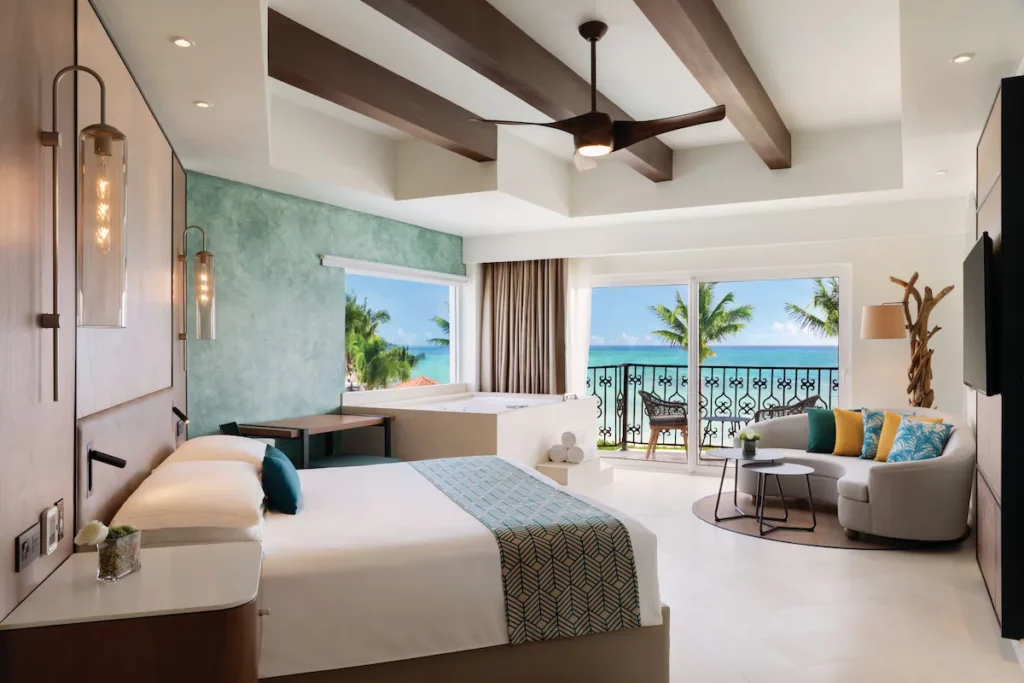 Spacious room with bath tub in the corner of the room.