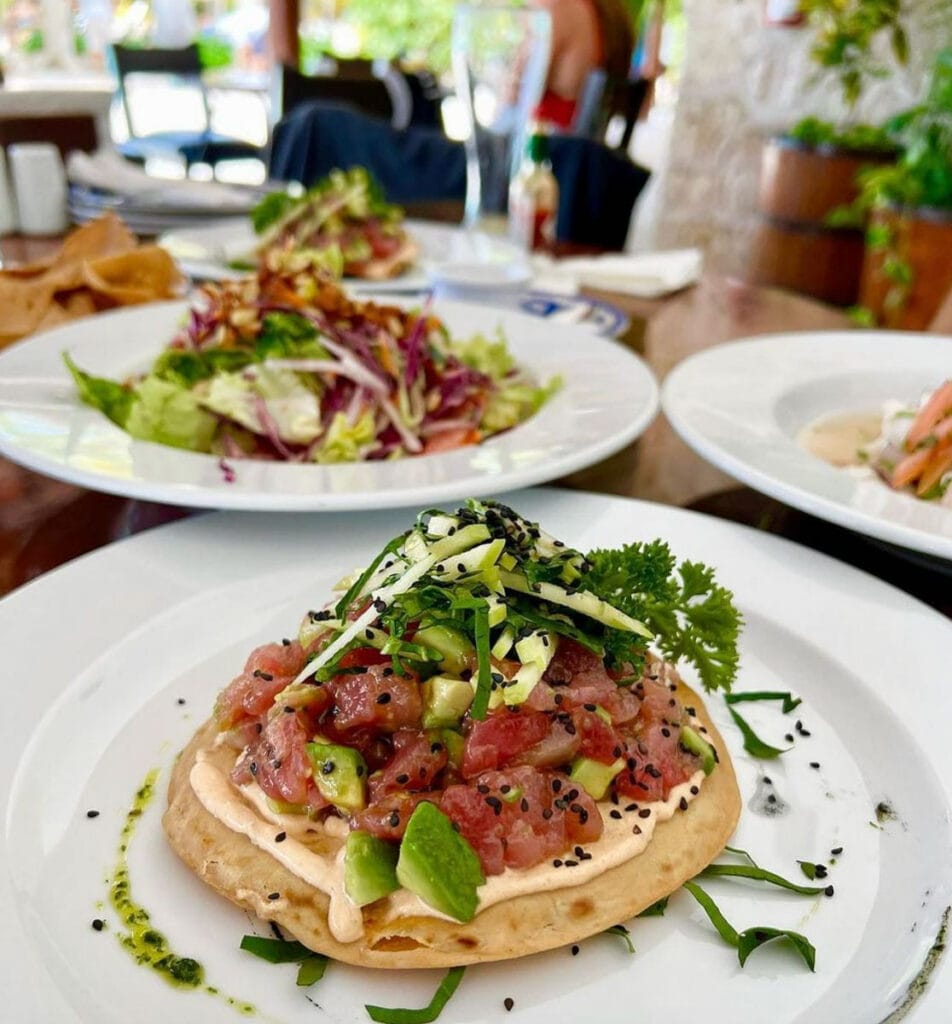Buccanos Beach Club restaurant tables with dishes