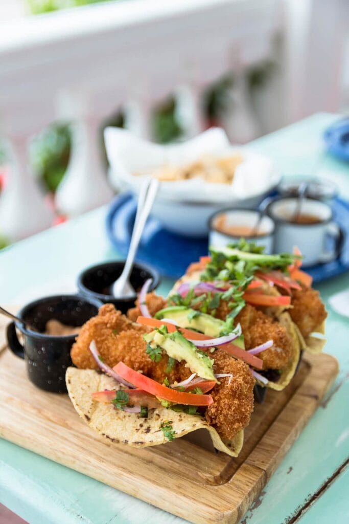 Tacos on a board.