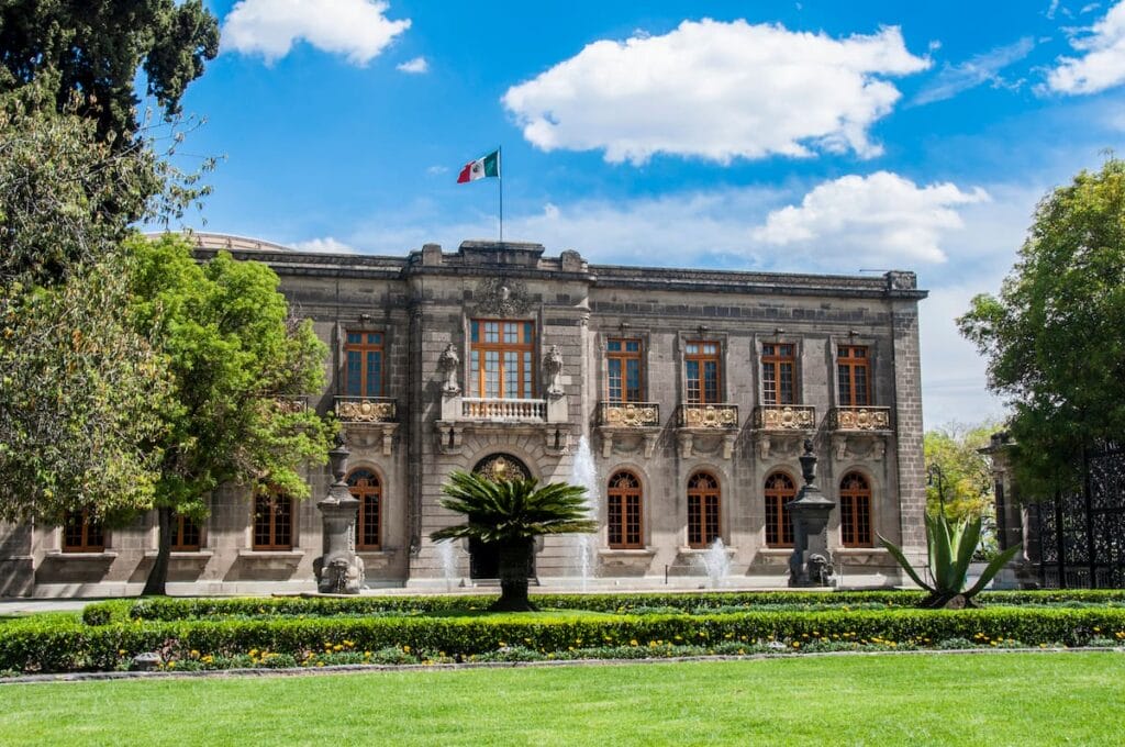 The Chapultepec Castle surrounded by small trees.