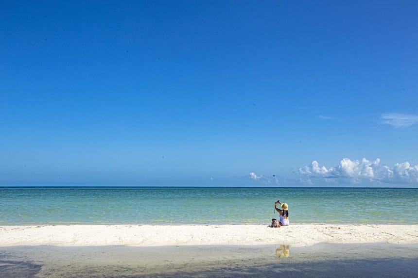 girl taking a selfie on the beach