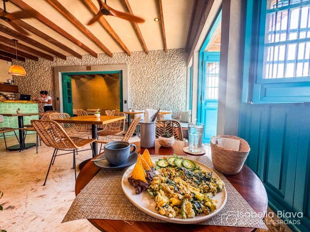 Cozy café with breakfast plate and wooden decor.