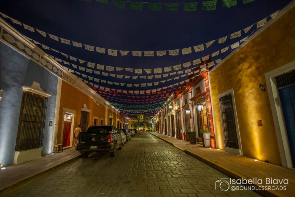 Colorful street with festive banners at night