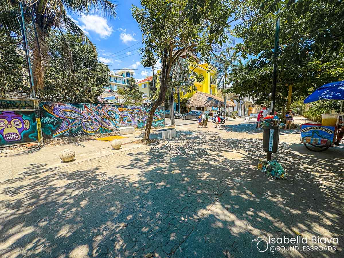 Colorful street art mural in sunny urban park